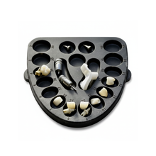 LaminateButler dental organizer tray with restorations and tools.
